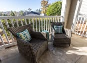 Thumbnail 20 of 40 - Model patio with two chairs at Ansley at Town Center in Evans GA