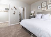 Thumbnail 10 of 40 - a bedroom with a large bed and a closet at Ansley at Town Center in Evans GA
