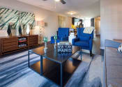 Thumbnail 25 of 40 - a living room with a coffee table with a parks sign on it at Ansley at Town Center, Evans, Georgia