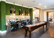 Thumbnail 8 of 30 - A room with green walls and a long wooden bench.