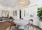 Thumbnail 16 of 18 - A modern dining room with a round table and chairs at Arcadia Cartersville Apartments, Cartersville, 30121