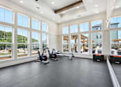 Thumbnail 15 of 18 - A spacious room with a treadmill and exercise bike at Arcadia Cartersville Apartments, Cartersville, GA