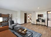 Thumbnail 12 of 29 - Living Room With Kitchen View at Artesian East Village in Atlanta