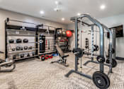 Thumbnail 20 of 27 - A well-equipped home gym with a variety of exercise equipment at Ansley at Town Center Apartments, Evans, GA