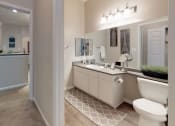 Thumbnail 8 of 36 - a bathroom with a toilet sink and mirror at Autumn Park Apartments, Charlotte, NC