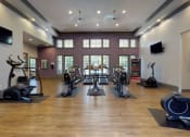 Thumbnail 18 of 36 - a gym with treadmills and other exercise equipment at Autumn Park Apartments, Charlotte, North Carolina