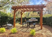 Thumbnail 31 of 36 - Trellised Outdoor Social & Picnic Areas surrounded by lush landscaping at Autumn Park Apartments, Charlotte, NC 28262