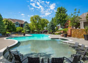 Thumbnail 14 of 19 - Refreshing Swimming Pool with Relaxing Poolside Patio at Cambridge Square Apartments, Overland Park, KS 66211
