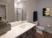 Thumbnail 5 of 17 - a bathroom with a toilet sink and shower
