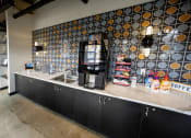 Thumbnail 14 of 23 - a coffee shop with a coffee machine on the side of the road at Conwood Flats, Memphis, TN, 38107