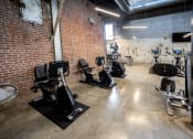 Thumbnail 18 of 23 - a fitness center with treadmills and elliptical machines at Conwood Flats, Memphis