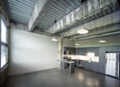 Thumbnail 5 of 23 - a kitchen with gray cabinets and a white refrigerator at Conwood Flats, Memphis, TN