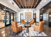 Thumbnail 33 of 41 - Elevator Lounge at Deca Apartments, Greenville, 29601