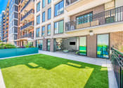Thumbnail 26 of 41 - Yoga lawn at Deca Apartments, South Carolina, 29601