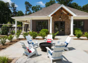 Thumbnail 26 of 34 - Outdoor Grilling Area with Seating & Fire Pit at Echo at North Pointe Center Apartment Homes, Alpharetta, GA 30009