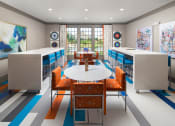 Thumbnail 17 of 34 - Exclusive Members Lounge with Shuffleboard, Card Tables, Kitchen & Fireplace at Echo at North Pointe Center Apartment Homes, Alpharetta, GA 30009