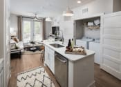 Thumbnail 1 of 34 - Open-Concept Kitchens with Quartz Countertops and Classic Shaker Cabinets at Echo at North Pointe Center Apartment Homes, Alpharetta, GA 30009
