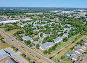 Thumbnail 22 of 22 - A bird's eye view of a residential area with houses and trees at Enclave at Wolfchase Apartments, Memphis, TN
