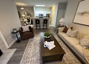 Thumbnail 3 of 22 - A living room with a couch at Enclave at Wolfchase Apartments, Memphis, Tennessee