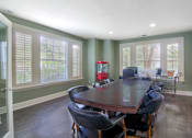 Thumbnail 16 of 22 - A dining room with a table and chairs at Enclave at Wolfchase Apartments, Memphis, TN 38016