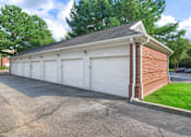 Thumbnail 19 of 22 - A two-car garage with a brick pillar on the side at Enclave at Wolfchase Apartments, Memphis