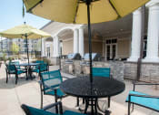 Thumbnail 18 of 21 - Pool grilling area at Fifth Street Place Apartments, Charlottesville, Virginia
