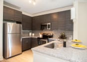 Thumbnail 1 of 21 - Model kitchen counters at Fifth Street Place Apartments, Virginia, 22903
