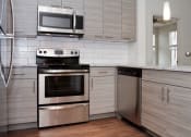 Thumbnail 4 of 21 - Model kitchen at Fifth Street Place Apartments, Virginia, 22903