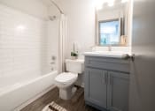 Thumbnail 6 of 19 - a bathroom with a toilet and a tub and a sink at 1900 Rosemont, Georgia
