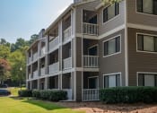 Thumbnail 16 of 19 - an exterior view of an apartment building on a sunny day