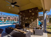 Thumbnail 13 of 30 - a view of a swimming pool with chairs and a ceiling at Arlo Luxury homes Apartments, Arkansas