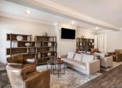 Thumbnail 15 of 30 - a living room with couches and chairs and a tv at Arlo Luxury homes Apartments, Little Rock, Arkansas