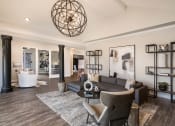 Thumbnail 12 of 30 - a living room with a couch and a table at Arlo Luxury homes Apartments, Little Rock, AR