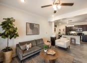 Thumbnail 2 of 30 - a living room with a couch and a table at Arlo Luxury homes Apartments, Little Rock, AR,72210
