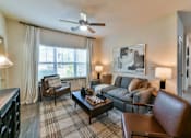 Thumbnail 4 of 28 - Gorgeous Modern Living Room with Wood Plank Vinyl Flooring (in Select Units) at Ashby at Ross Bridge, Hoover