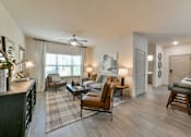 Thumbnail 8 of 28 - Gorgeous Modern Living Room with Two Tone Paint Colors and Wood Plank Vinyl Flooring (in Select Units) at Ashby at Ross Bridge, Hoover