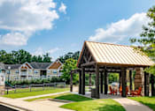 Thumbnail 23 of 28 - a pavilion with a lawn and trees in the background at Ashby at Ross Bridge, Hoover, AL