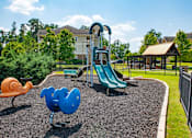 Thumbnail 20 of 28 - Children have a place to run and play at Alden Place too! Slides, Climbing Equipment and Bike Parking at Ashby at Ross Bridge, Hoover