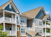 Thumbnail 18 of 28 - Apartment Home Exteriors with Trees Inviting You Inside at Ashby at Ross Bridge, Hoover, AL