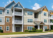 Thumbnail 19 of 28 - Bright Apartment Exteriors with Trees Inviting You Inside at Ashby at Ross Bridge, Hoover, AL 35226