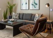 Thumbnail 8 of 14 - a living room with a couch and a coffee table at Esplanade District Apartments, Little Rock, Arkansas