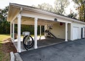 Thumbnail 31 of 34 - the front of a garage with a gas pump in the driveway at Legends at Chatham, Georgia, 31405