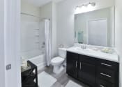 Thumbnail 12 of 34 - a bathroom with a shower toilet and sink at Legends at Chatham, Savannah, GA