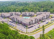 Thumbnail 27 of 28 - an aerial view of a building surrounded by trees