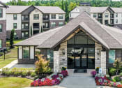 Thumbnail 22 of 28 - the front of a building with apartments in the background