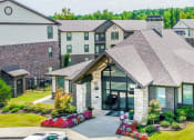 Thumbnail 23 of 28 - an aerial view of a house with an apartment building in the background