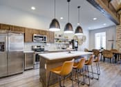 Thumbnail 19 of 29 - Fitted Kitchen With Island Dining at McKenzie Park Apartments, Little Rock
