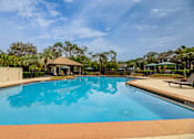 Thumbnail 42 of 58 - A large swimming pool with a gazebo in the background.