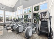 Thumbnail 21 of 31 - a gym with cardio equipment and windows at The Ridge at Chenal Valley, Little Rock, 72223