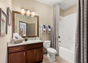 Thumbnail 8 of 31 - a view of a bathroom with a toilet and a sink at The Ridge at Chenal Valley, Little Rock, AR 72223
